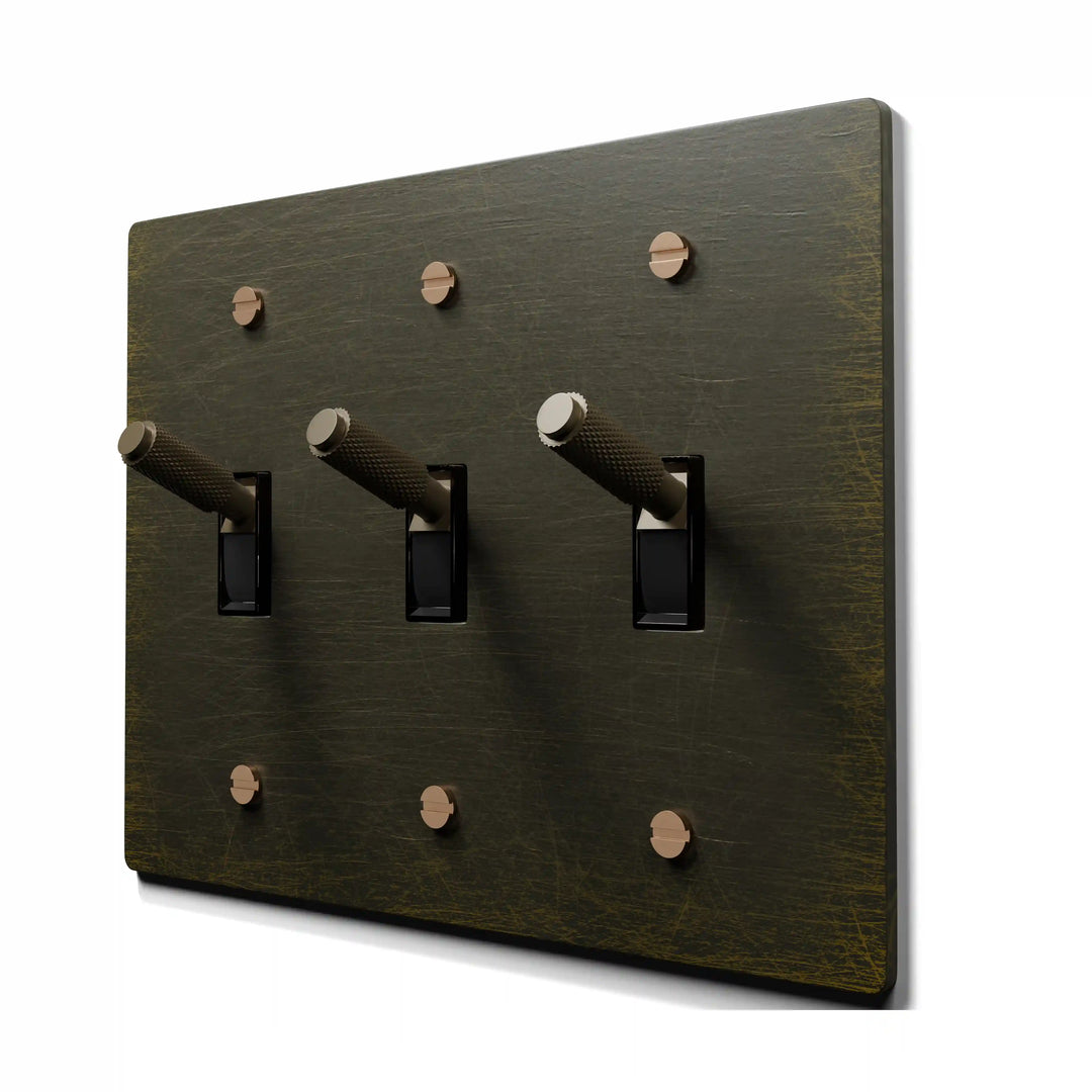 3 gang knurled toggle light switch with antique brass wall plate