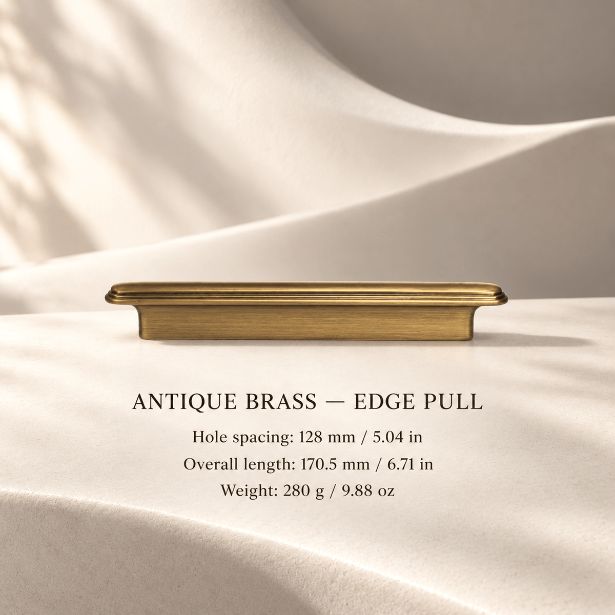 Antique brass edge pull in ivory studio. Hole spacing: 128 mm / 5.04 in; Overall length: 170.5 mm / 6.71 in; Weight: 280 g / 9.88 oz.