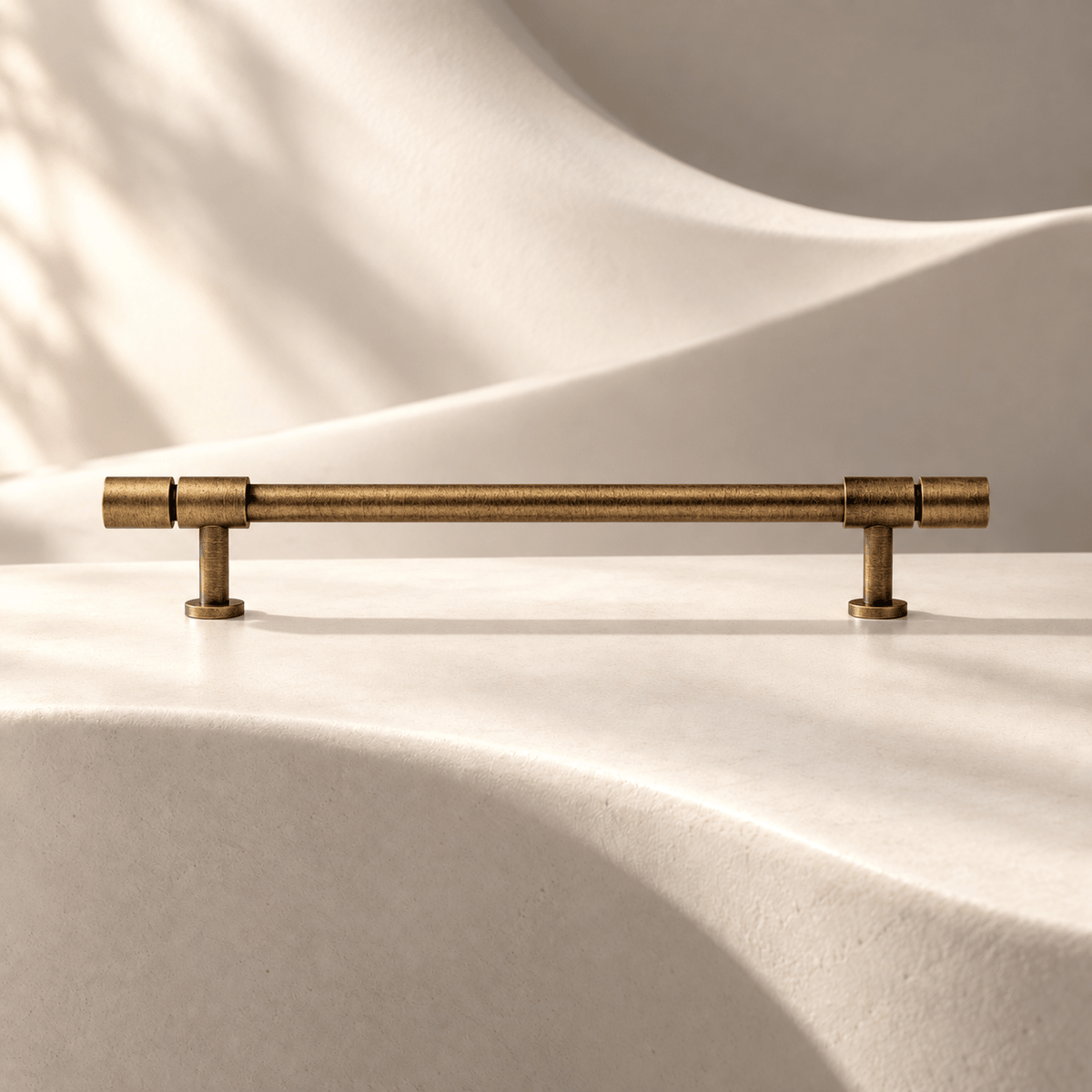 Antique bronze cylindrical cabinet pull, 160 mm hole spacing on ivory stone