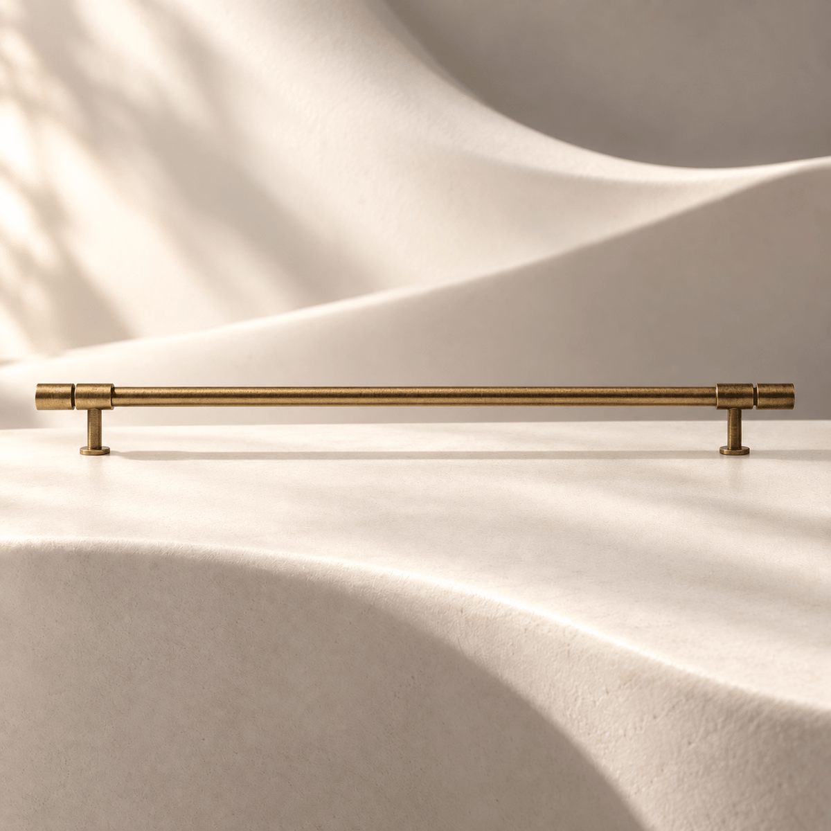Antique bronze cylindrical cabinet pull, 320 mm hole spacing on ivory stone