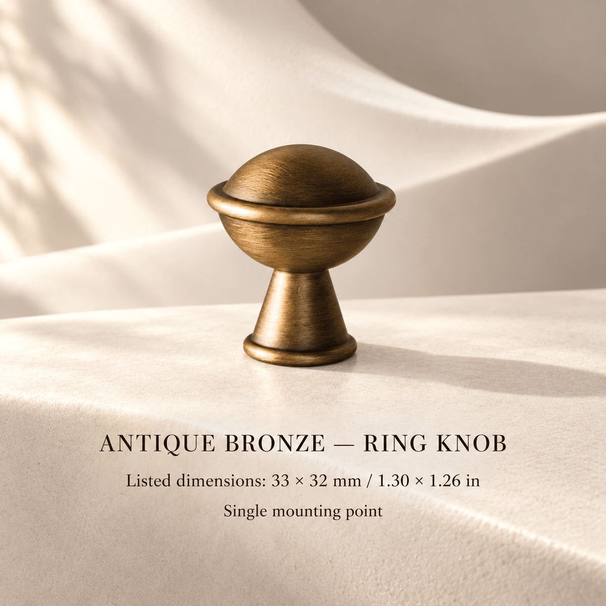 Antique bronze ring knob in ivory studio. Listed dimensions: 33 × 32 mm / 1.30 × 1.26 in; Single mounting point