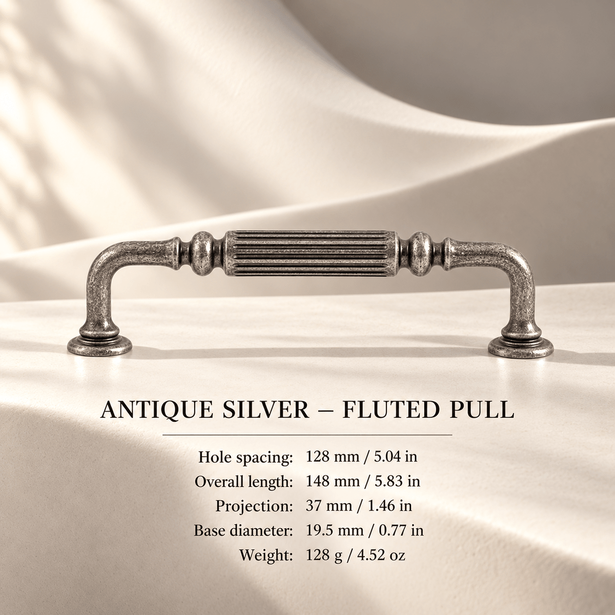 Antique silver fluted cabinet pull in ivory studio. Hole spacing: 128 mm / 5.04 in; Overall length: 148 mm / 5.83 in; Projection: 37 mm / 1.46 in; Base diameter: 19.5 mm / 0.77 in; Weight: 128 g / 4.52 oz