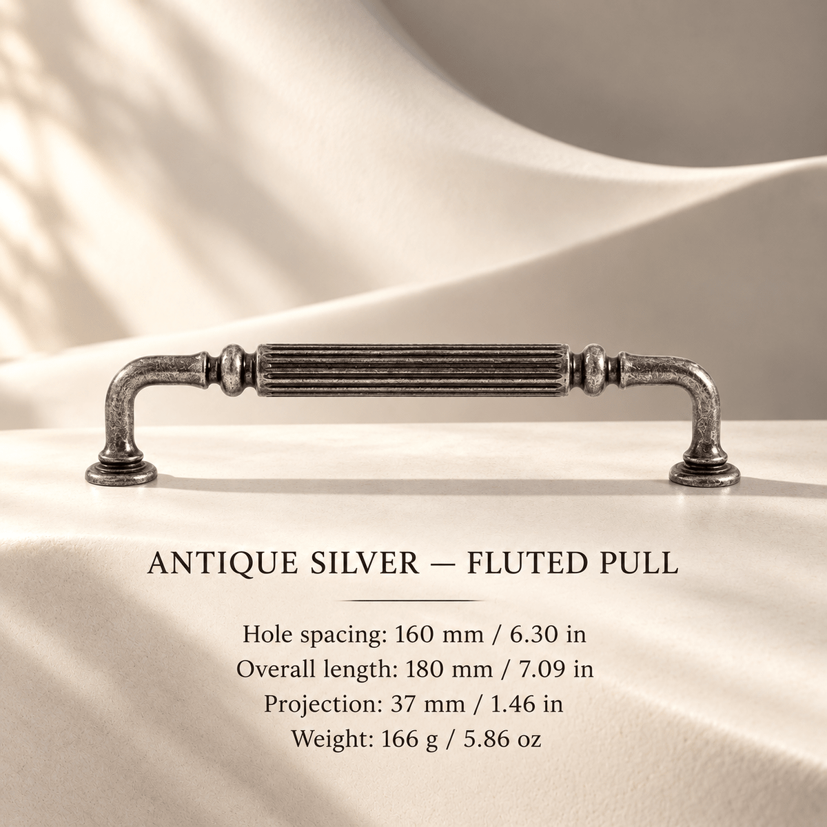 Antique silver fluted cabinet pull in ivory studio. Hole spacing: 160 mm / 6.30 in; Overall length: 180 mm / 7.09 in; Projection: 37 mm / 1.46 in; Weight: 166 g / 5.86 oz