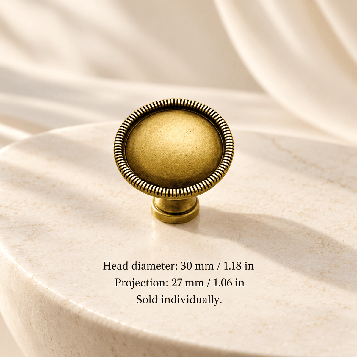 Antique gold Single-hole knob — 30 mm / 1.18 in diameter; Head diameter: 30 mm / 1.18 in; Projection: 27 mm / 1.06 in; sold individually on ivory stone studio background