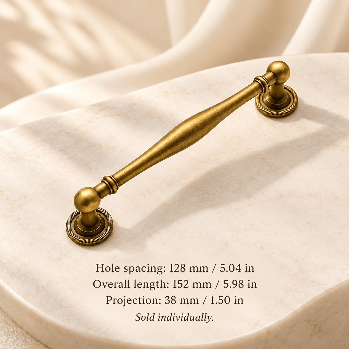 Antique gold 128 mm / 5.04 in CTC — 1 piece; Hole spacing: 128 mm / 5.04 in; Overall length: 152 mm / 5.98 in; Projection: 38 mm / 1.50 in; sold individually on ivory stone studio background