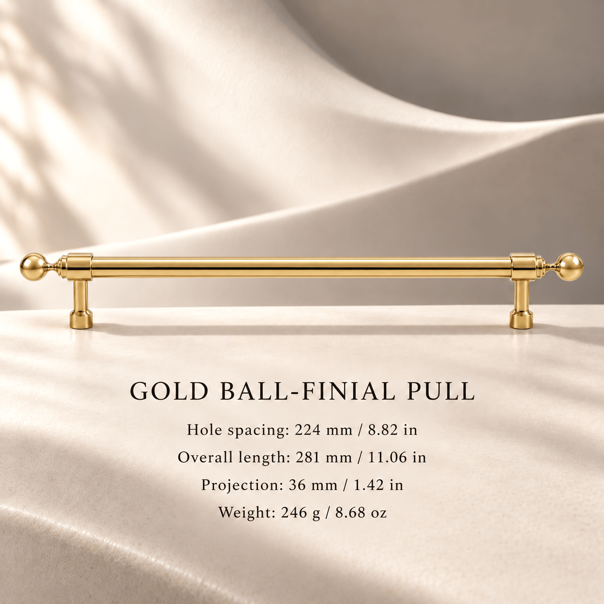 Gold ball-finial cabinet pull in ivory studio. Hole spacing: 224 mm / 8.82 in; Overall length: 281 mm / 11.06 in; Projection: 36 mm / 1.42 in; Weight: 246 g / 8.68 oz.