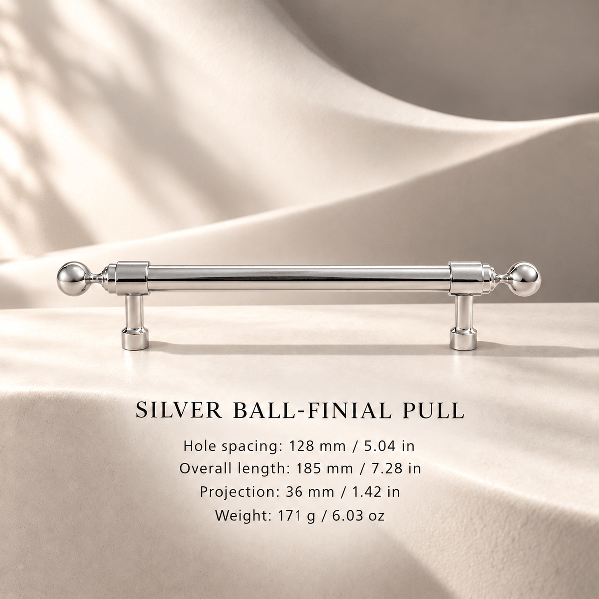 Silver ball-finial cabinet pull in ivory studio. Hole spacing: 128 mm / 5.04 in; Overall length: 185 mm / 7.28 in; Projection: 36 mm / 1.42 in; Weight: 171 g / 6.03 oz.