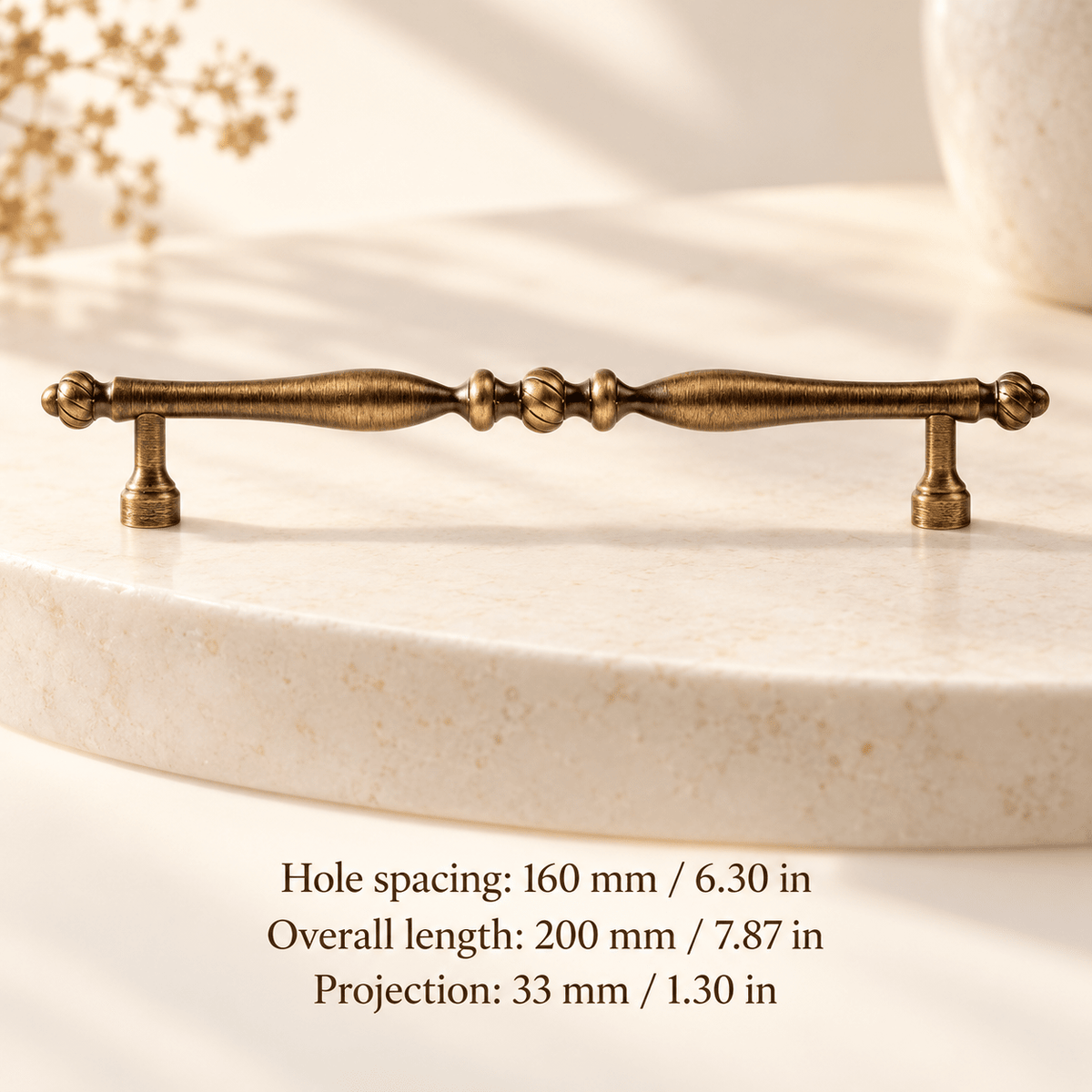 Antique bronze spindle pull in ivory studio. Hole spacing: 160 mm / 6.30 in; Overall length: 200 mm / 7.87 in; Projection: 33 mm / 1.30 in