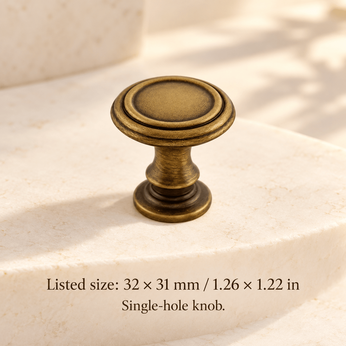 Antique bronze classic concentric round pedestal knob in ivory studio. Listed size: 32 × 31 mm / 1.26 × 1.22 in; Single-hole knob