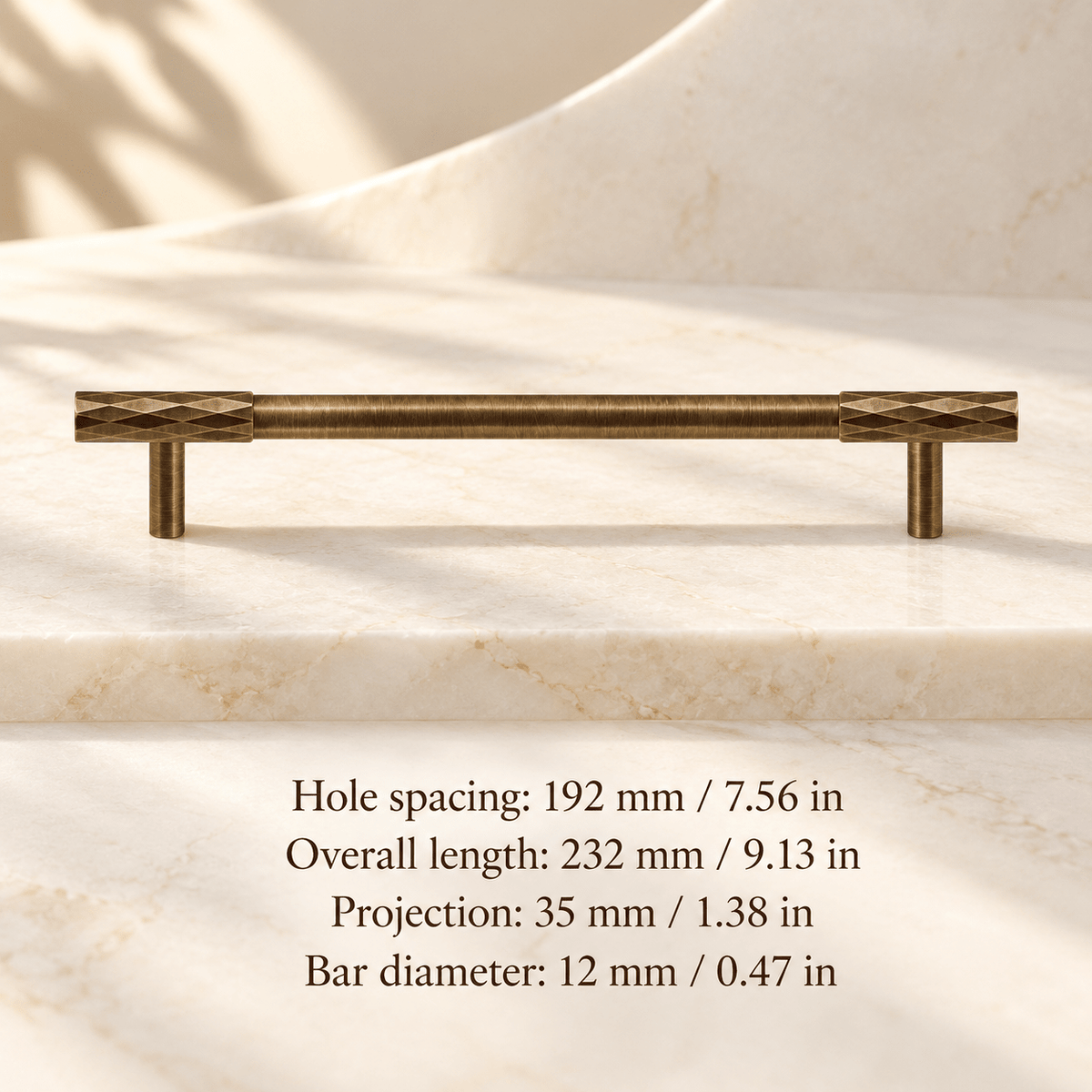 Antique bronze faceted cabinet pull in ivory studio. Hole spacing: 192 mm / 7.56 in; Overall length: 232 mm / 9.13 in; Projection: 35 mm / 1.38 in; Bar diameter: 12 mm / 0.47 in