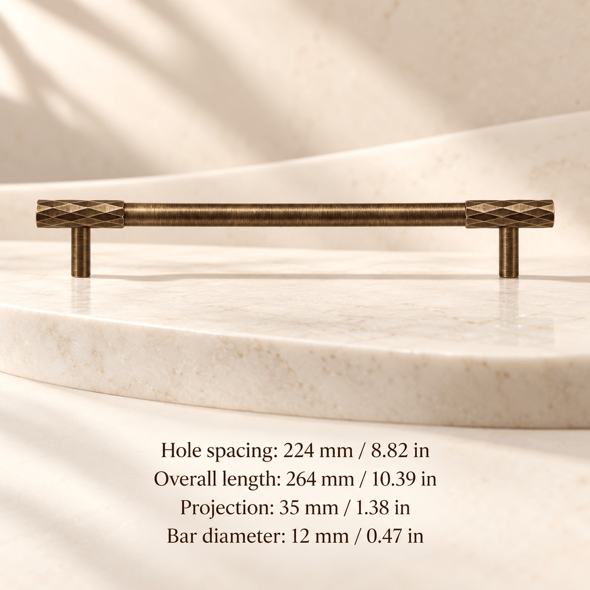 Antique bronze faceted cabinet pull in ivory studio. Hole spacing: 224 mm / 8.82 in; Overall length: 264 mm / 10.39 in; Projection: 35 mm / 1.38 in; Bar diameter: 12 mm / 0.47 in
