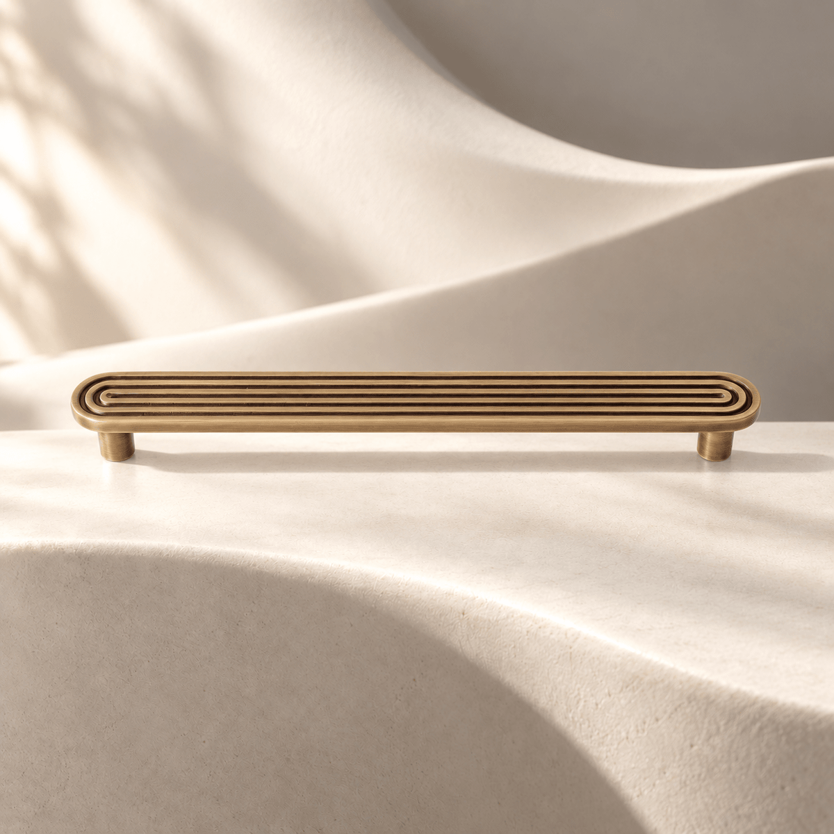 Bronze grooved cabinet pull, 192 mm hole spacing on ivory stone