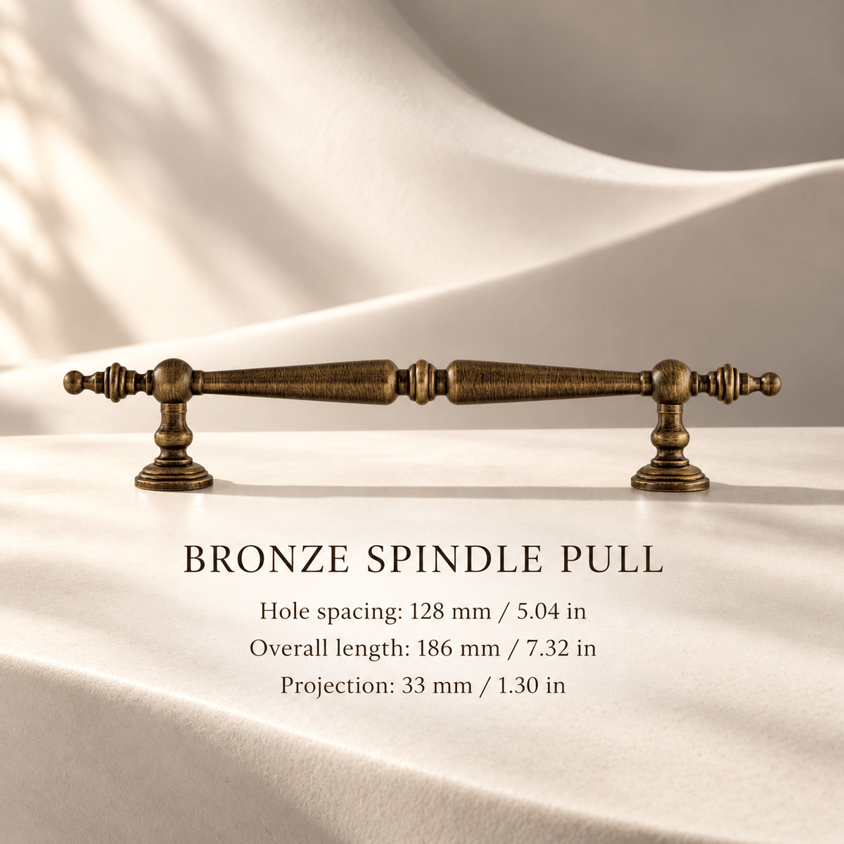 Bronze ornate spindle cabinet pull, 128 mm CTC — individual measurements in millimeters and inches