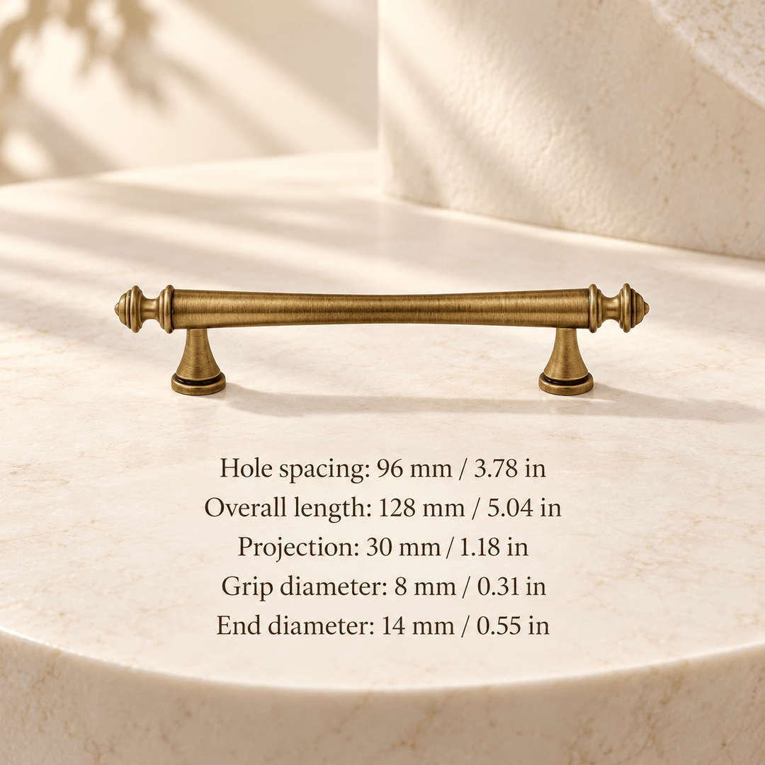 Antique bronze pointed finial 96 mm / 3.78 in CTC; Hole spacing: 96 mm / 3.78 in; Overall length: 128 mm / 5.04 in; Projection: 30 mm / 1.18 in; Grip diameter: 8 mm / 0.31 in; End diameter: 14 mm / 0.55 in on ivory stone studio background
