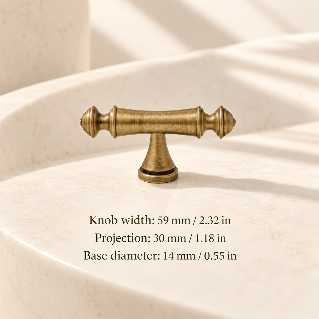 Antique bronze pointed finial T-knob — 59 mm / 2.32 in width; Knob width: 59 mm / 2.32 in; Projection: 30 mm / 1.18 in; Base diameter: 14 mm / 0.55 in on ivory stone studio background