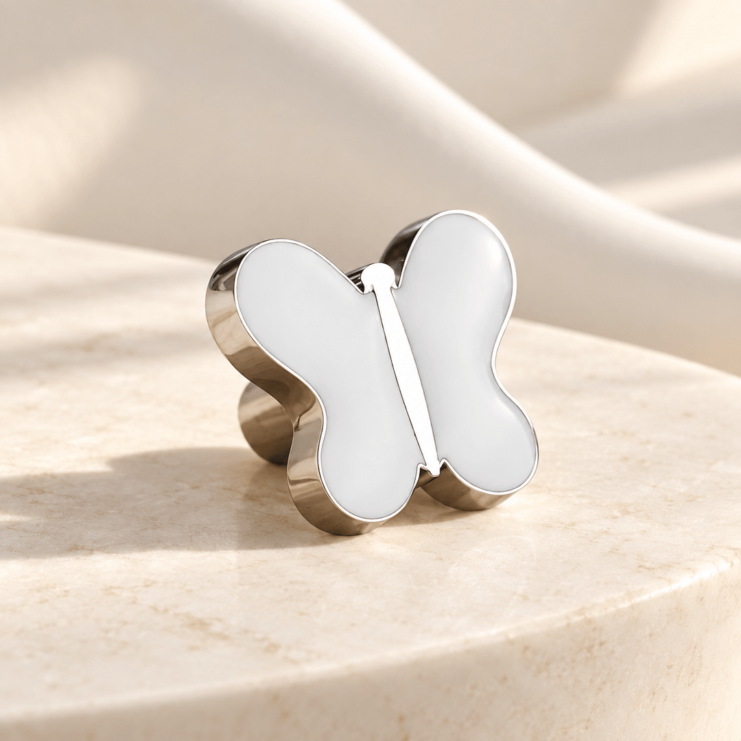 White butterfly cabinet knob in silver finish on ivory stone