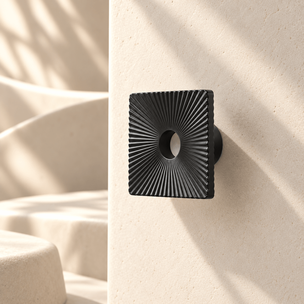 Charcoal square sunburst cabinet pull, 40 mm face — warm ivory studio