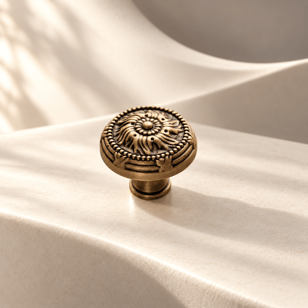 Classic antique bronze cabinet knob — 32 mm on warm ivory stone