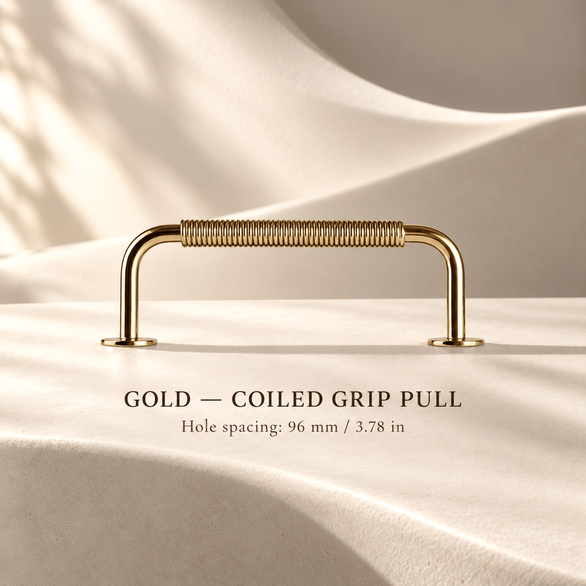 Gold coiled-grip cabinet pull in ivory studio. Hole spacing: 96 mm / 3.78 in