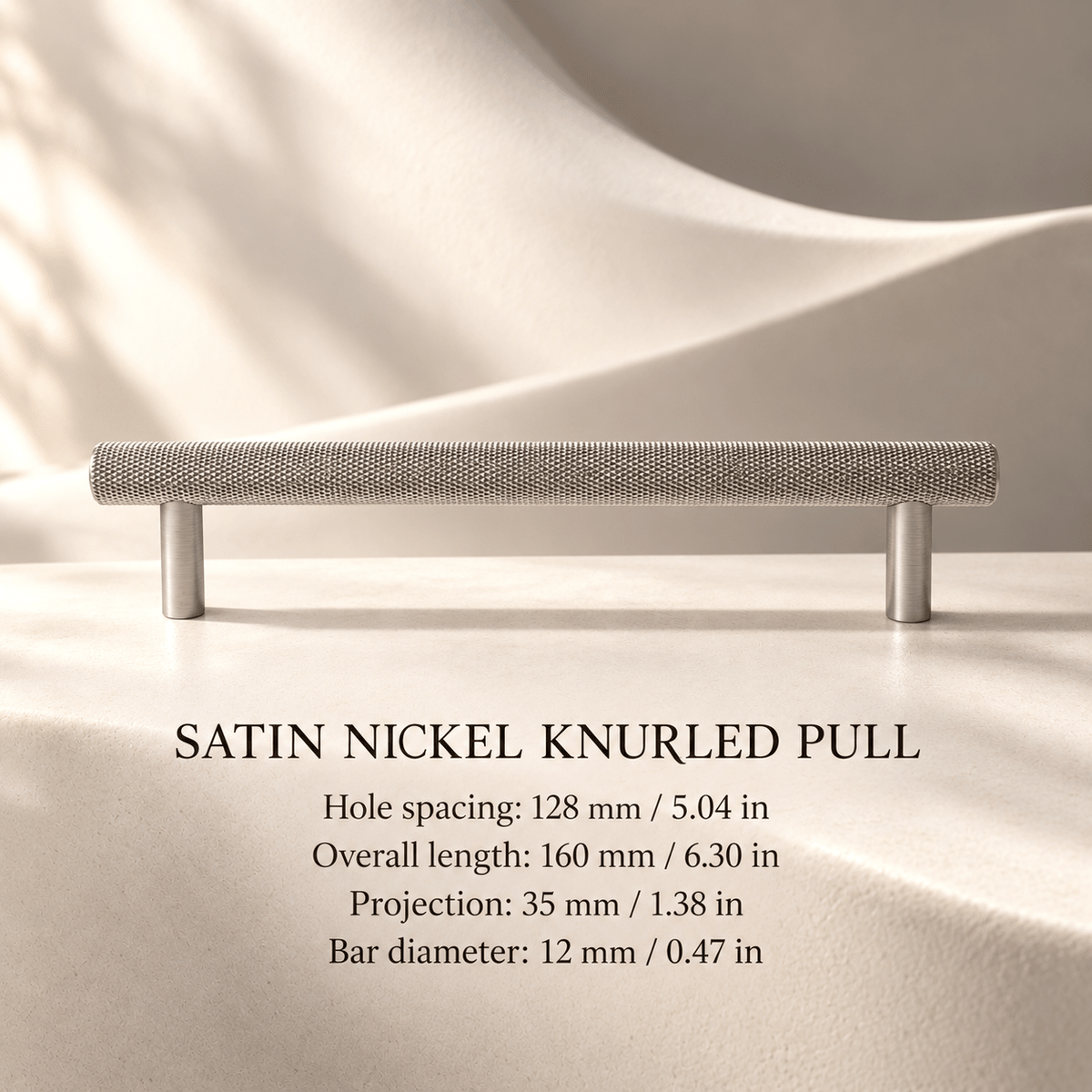 Satin nickel cross-knurled cabinet pull, 128 mm (5.04 in) hole spacing, 160 mm (6.30 in) overall length, 35 mm (1.38 in) projection and 12 mm (0.47 in) bar diameter, ivory studio.