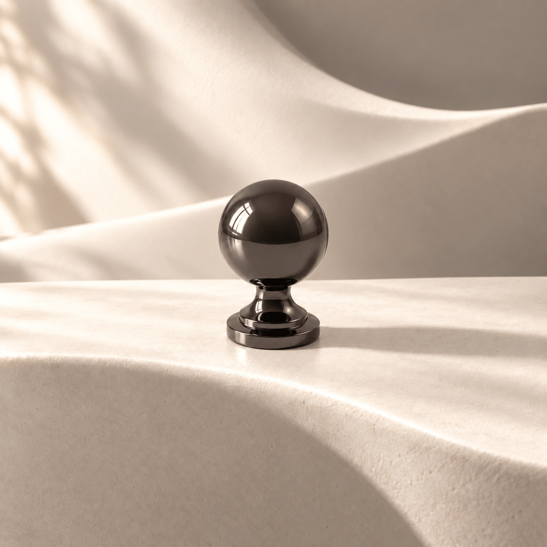 Dark French sphere knob — warm ivory studio