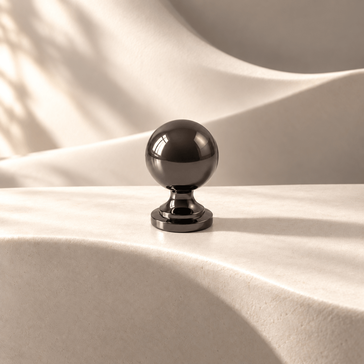 Dark French sphere knob — warm ivory studio