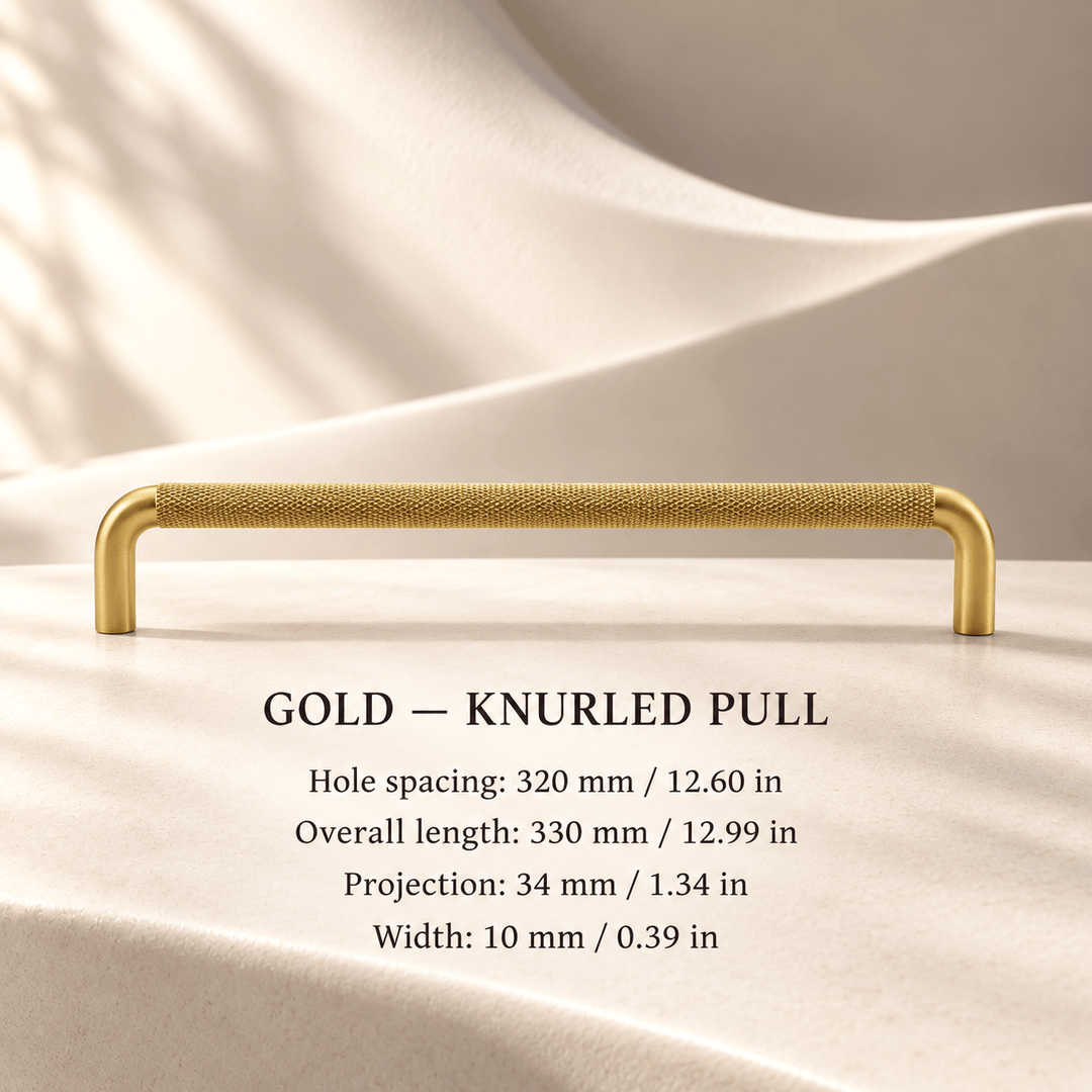 Gold knurled cabinet pull in ivory studio. Hole spacing: 320 mm / 12.60 in; Overall length: 330 mm / 12.99 in; Projection: 34 mm / 1.34 in; Width: 10 mm / 0.39 in