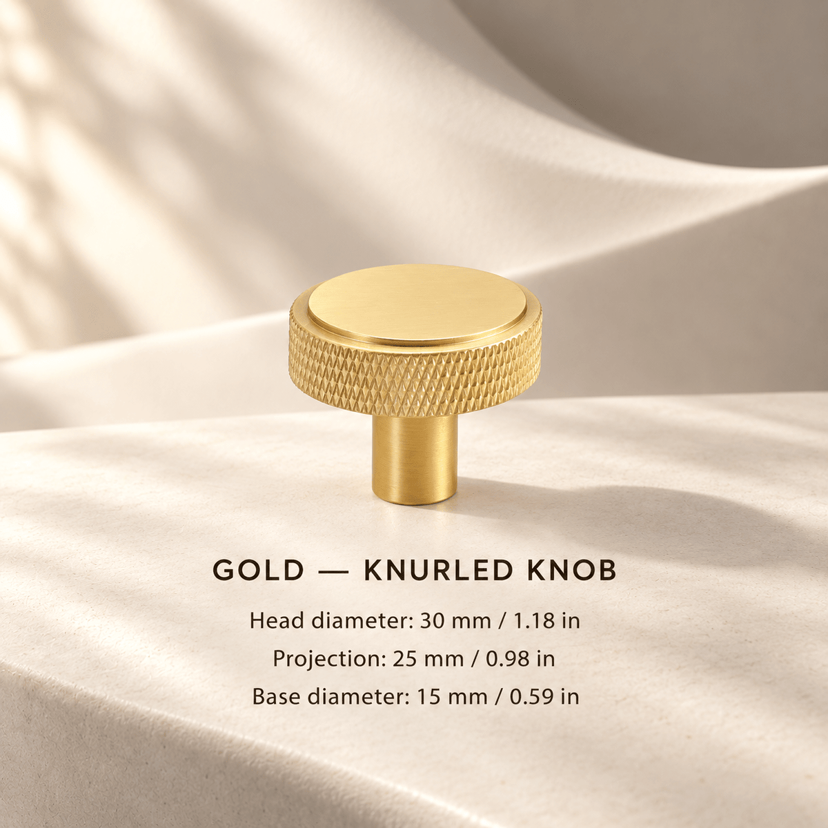 Gold knurled cabinet knob in ivory studio. Head diameter: 30 mm / 1.18 in; Projection: 25 mm / 0.98 in; Base diameter: 15 mm / 0.59 in
