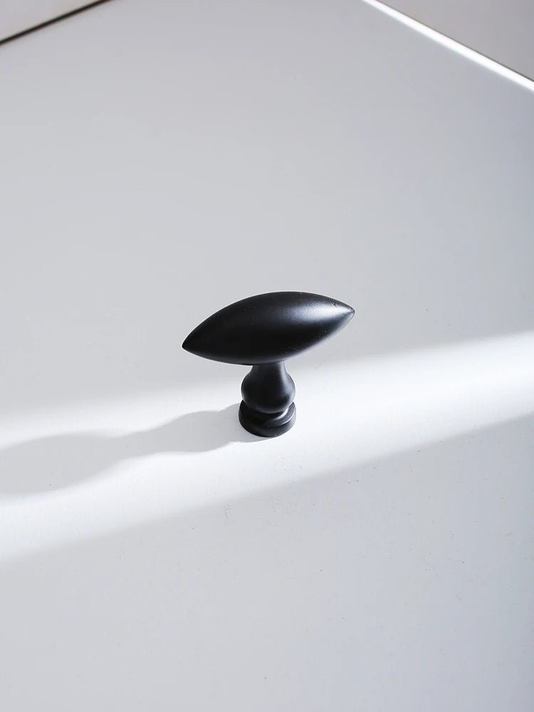 Matte Black Brass Knobs with Gold Accents for Elegant Cabinets