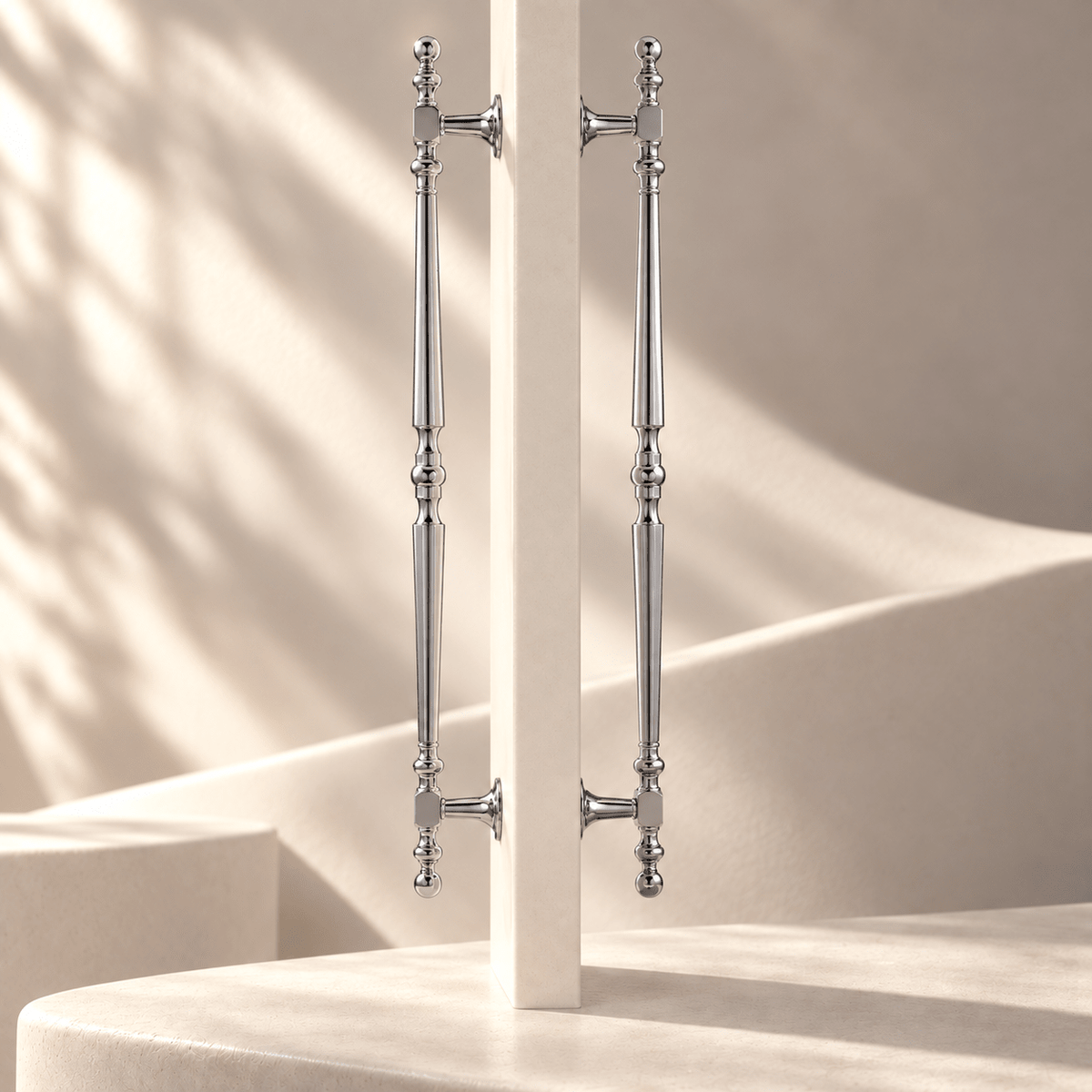 French-style silver finish door pull pair in an ivory stone studio