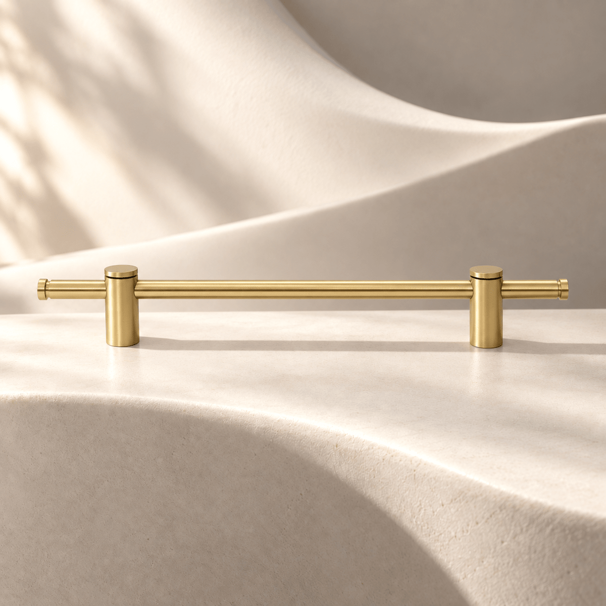 Gold brass adjustable cabinet pull, 360 mm overall length on warm ivory stone