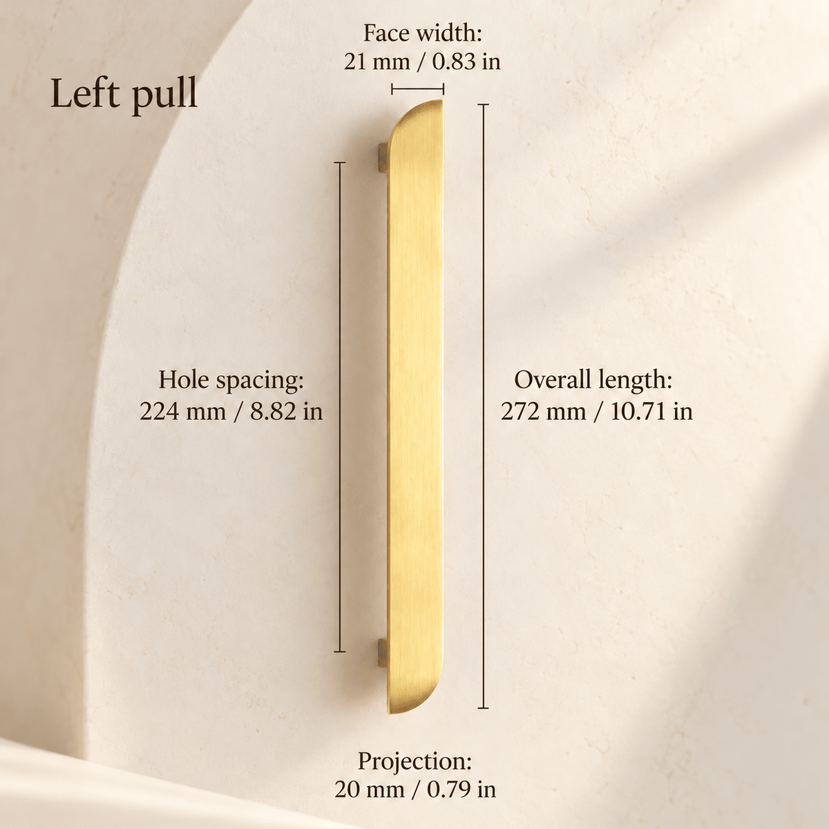 Gold asymmetric left cabinet pull in ivory studio. Hole spacing: 224 mm / 8.82 in; Overall length: 272 mm / 10.71 in; Face width: 21 mm / 0.83 in; Projection: 20 mm / 0.79 in