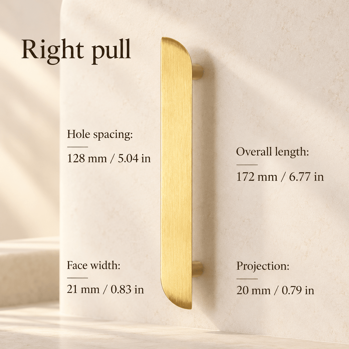 Gold asymmetric right cabinet pull in ivory studio. Hole spacing: 128 mm / 5.04 in; Overall length: 172 mm / 6.77 in; Face width: 21 mm / 0.83 in; Projection: 20 mm / 0.79 in