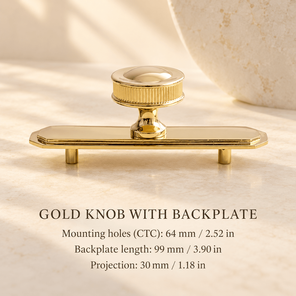 Glossy gold brass knob with backplate — mounting holes 64 mm / 2.52 in, length 99 mm / 3.90 in, projection 30 mm / 1.18 in — ivory stone studio