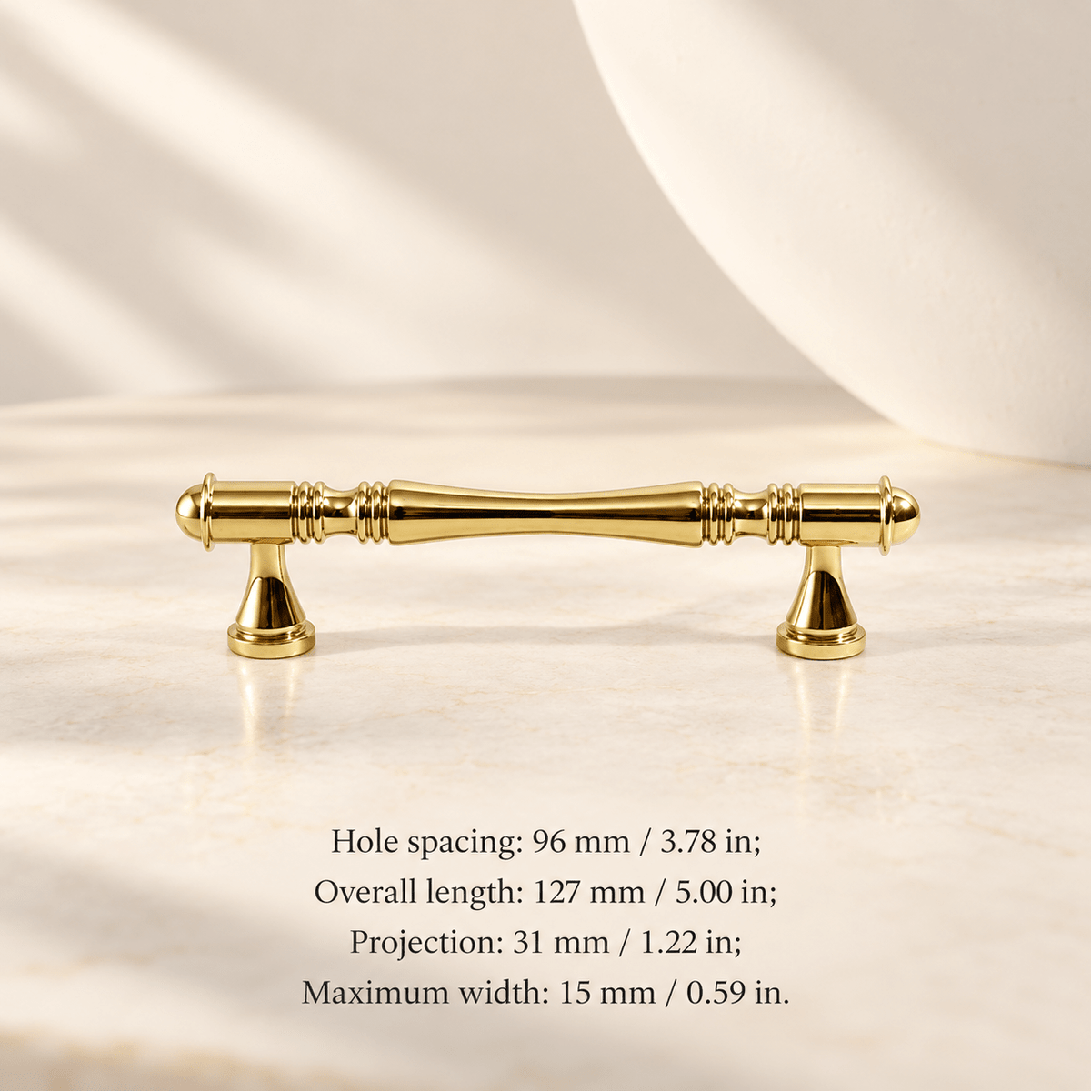 Gold classic spindle cabinet pull in ivory studio. Hole spacing: 96 mm / 3.78 in; Overall length: 127 mm / 5.00 in; Projection: 31 mm / 1.22 in; Maximum width: 15 mm / 0.59 in