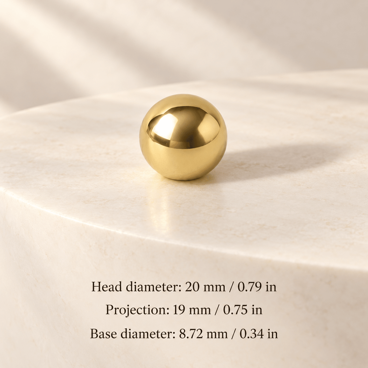 Polished gold ball knob in ivory studio. Head diameter: 20 mm / 0.79 in; Projection: 19 mm / 0.75 in; Base diameter: 8.72 mm / 0.34 in