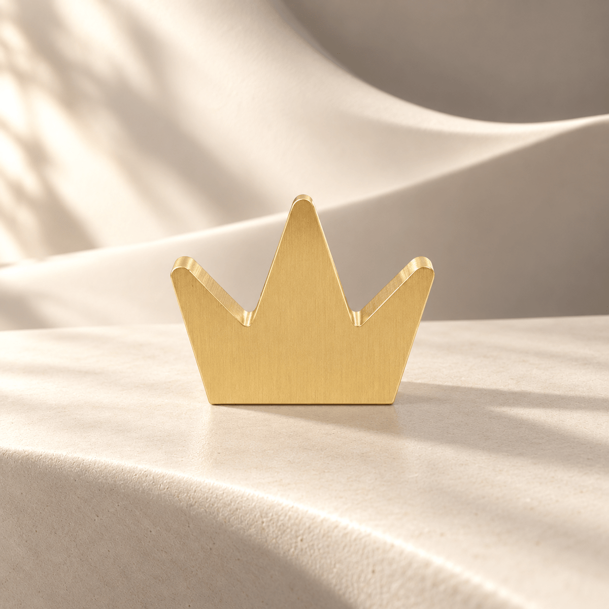 Gold crown cabinet knob, warm ivory stone studio