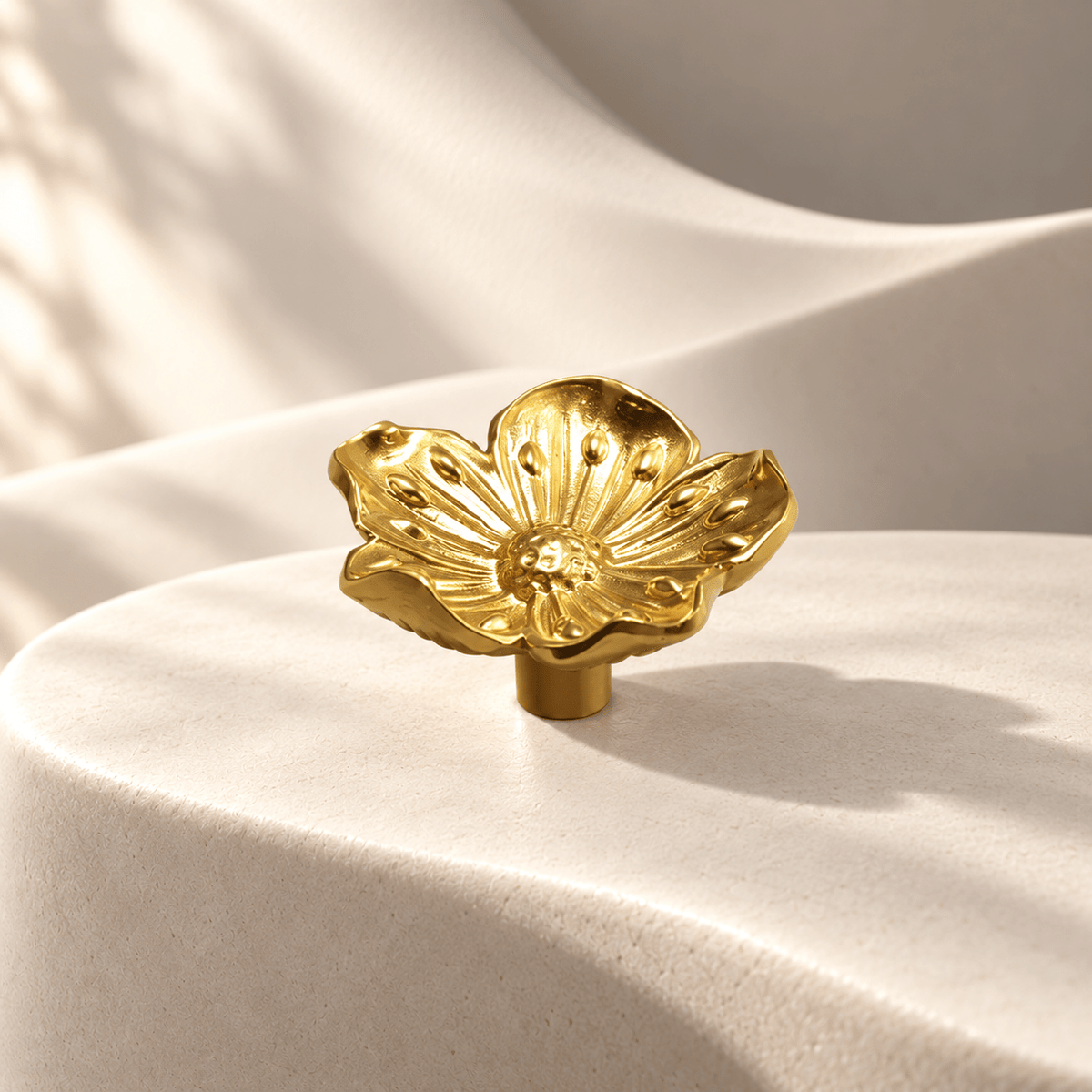 Gold flower cabinet knob, 43 × 43 mm face — warm ivory sculptural stone studio