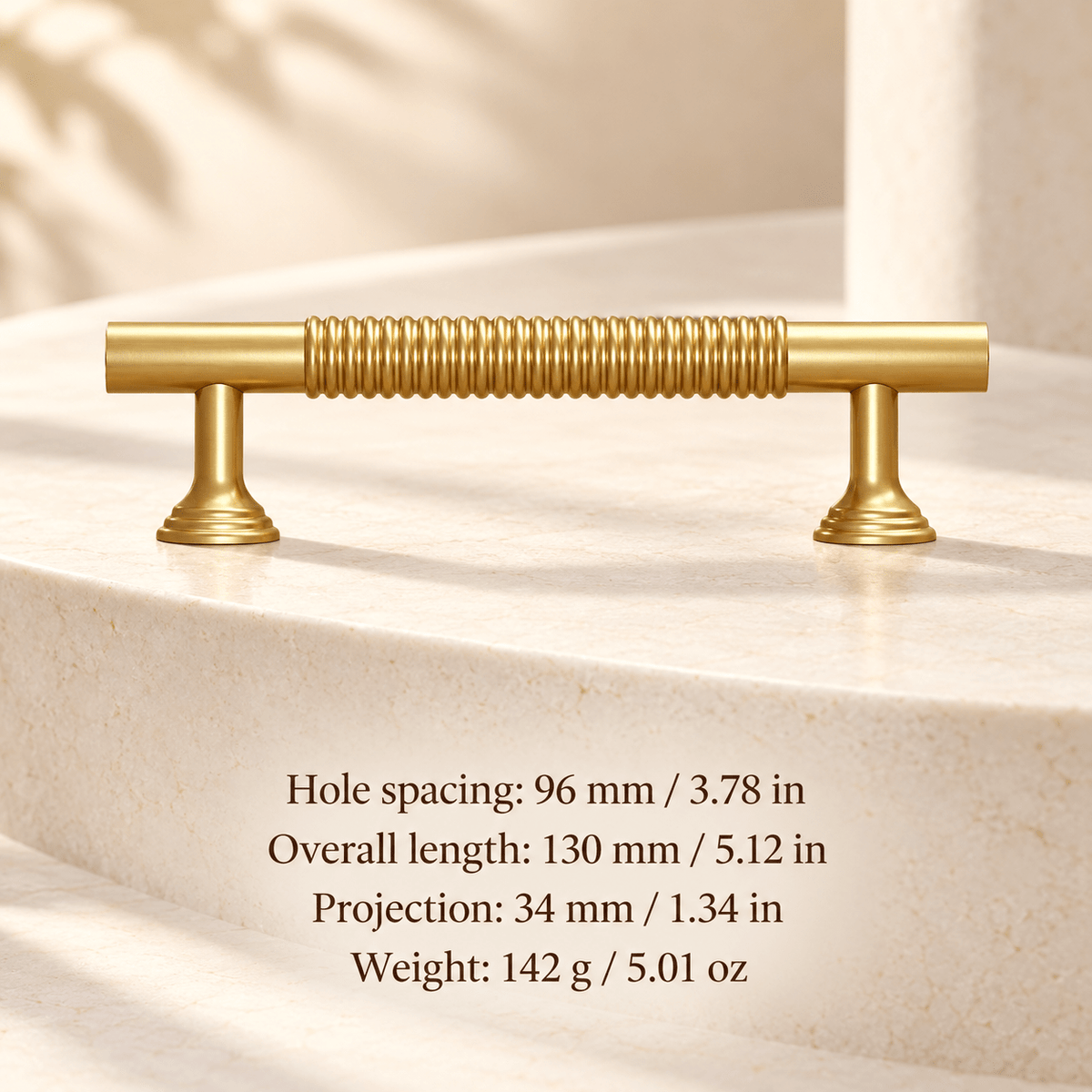 Gold ribbed cabinet pull in ivory studio. Hole spacing: 96 mm / 3.78 in; Overall length: 130 mm / 5.12 in; Projection: 34 mm / 1.34 in; Weight: 142 g / 5.01 oz