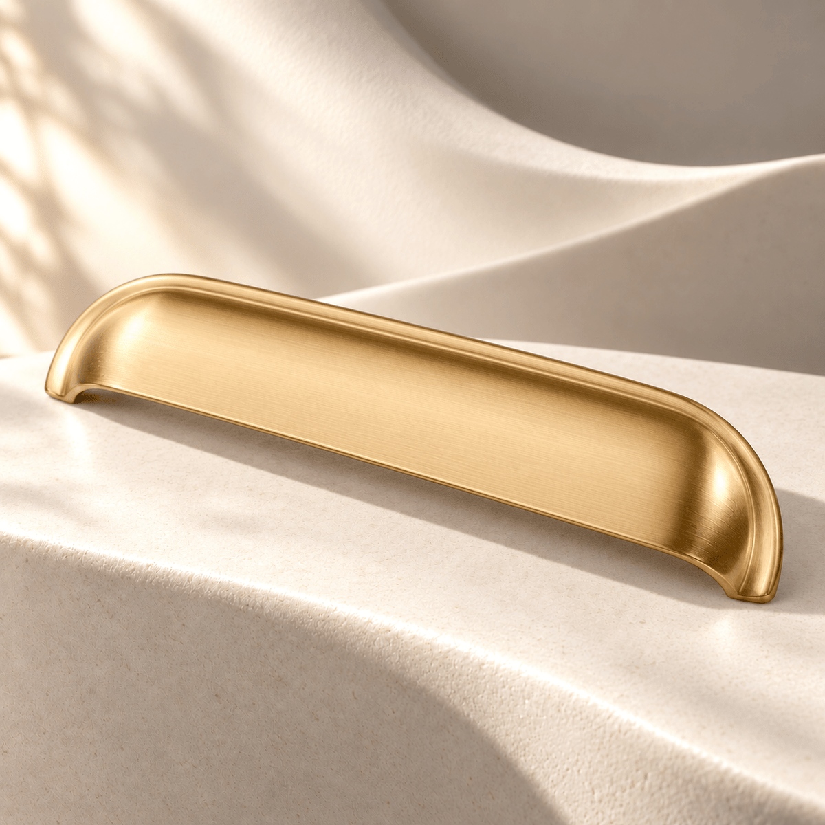Gold brass shell cup pull, 128 mm hole spacing, one piece in ivory stone studio