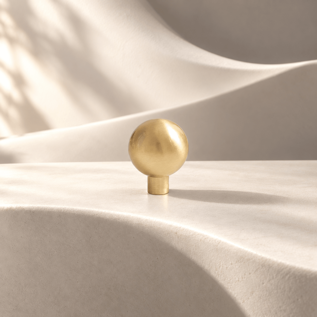 Gold sphere knob, 28 mm head with straight stem — warm ivory stone studio