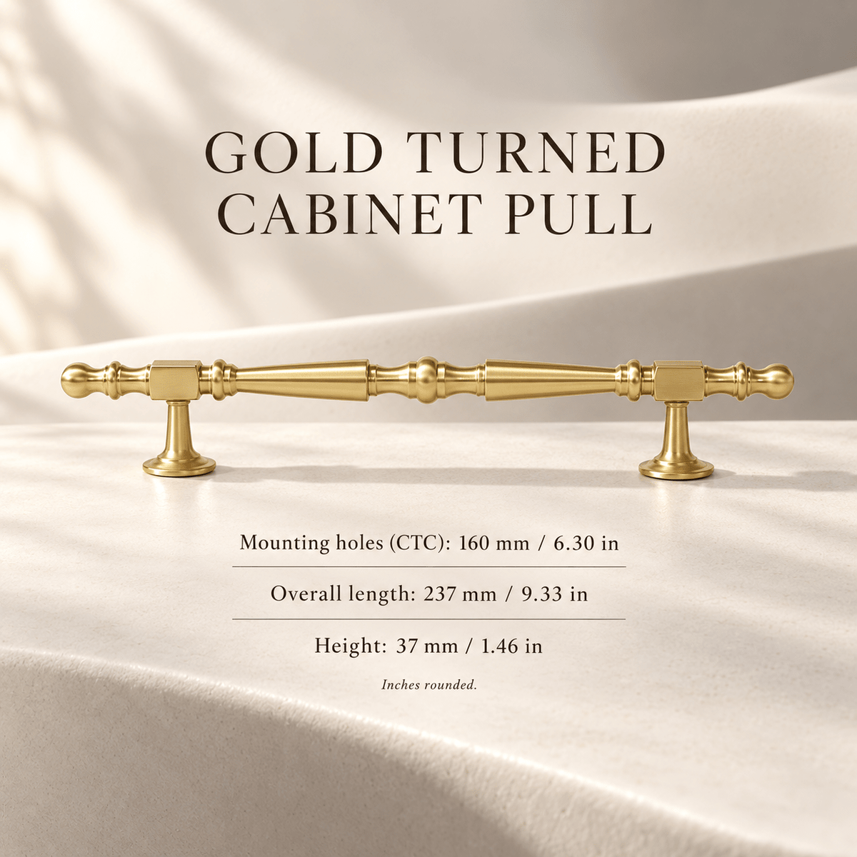 Gold turned cabinet pull on ivory stone; mounting holes 160 mm / 6.30 in, overall length 237 mm / 9.33 in, height 37 mm / 1.46 in