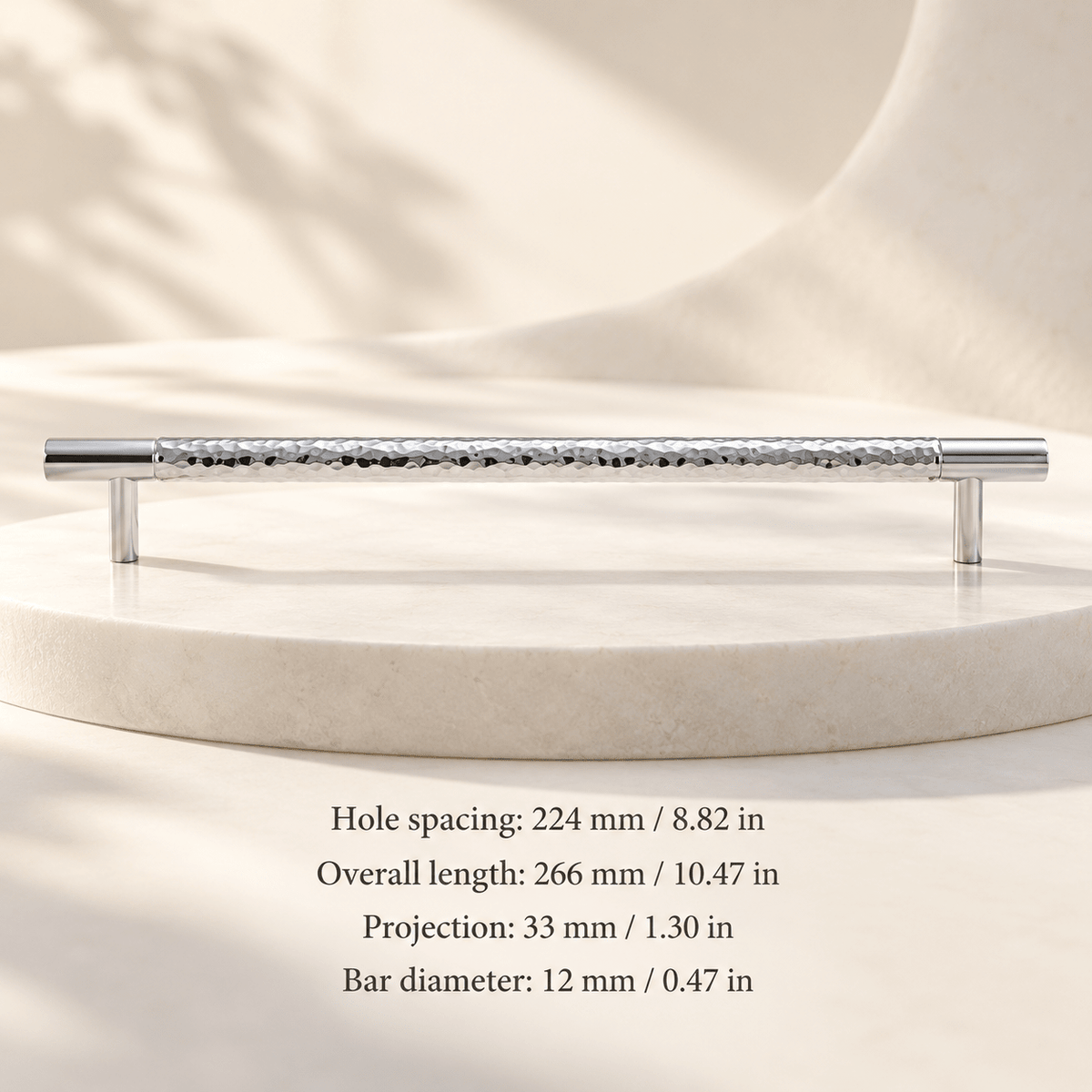 Hammered chrome cabinet pull 224 mm / 8.82 in CTC; Hole spacing: 224 mm / 8.82 in; Overall length: 266 mm / 10.47 in; Projection: 33 mm / 1.30 in; Bar diameter: 12 mm / 0.47 in on ivory stone studio background