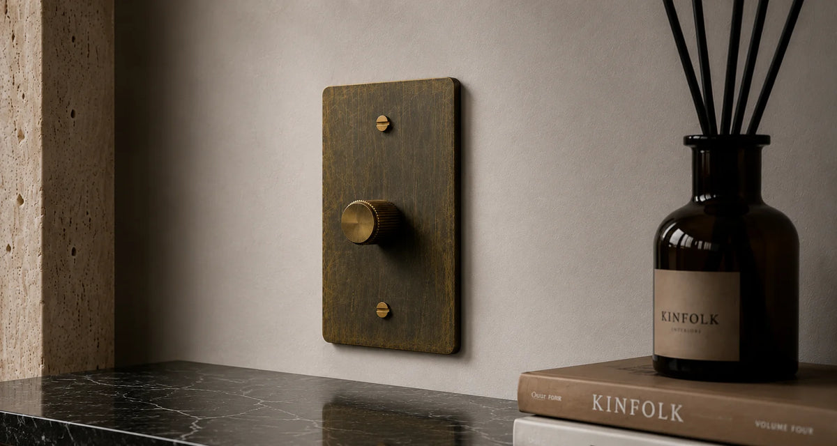 PlatePrestige brass electrical hardware in an interior setting