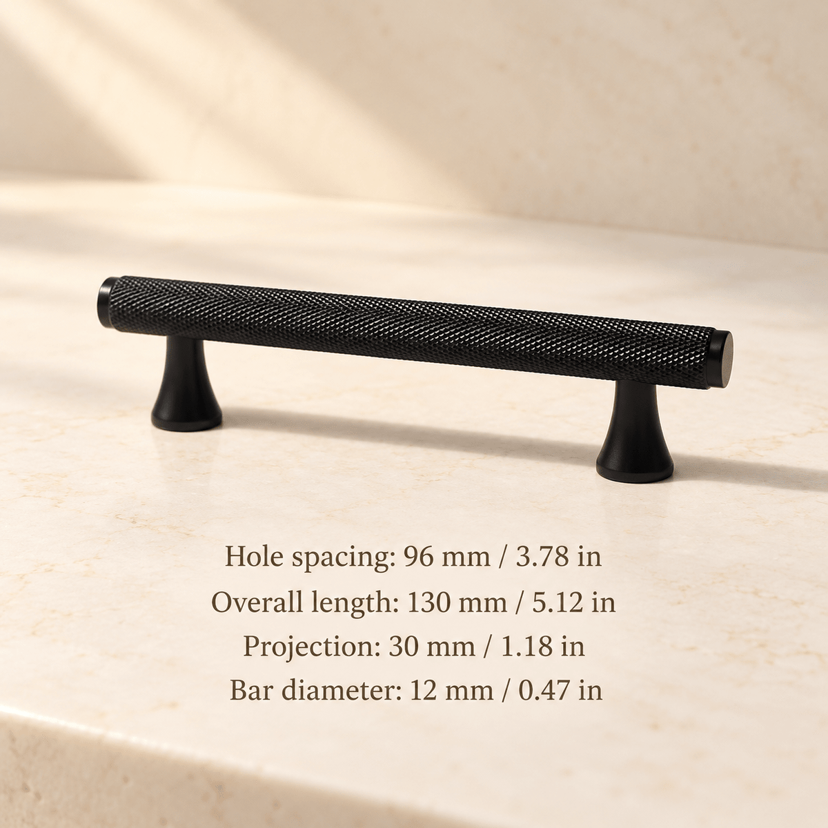 Black knurled cabinet pull with flared feet in ivory studio. Hole spacing: 96 mm / 3.78 in; Overall length: 130 mm / 5.12 in; Projection: 30 mm / 1.18 in; Bar diameter: 12 mm / 0.47 in