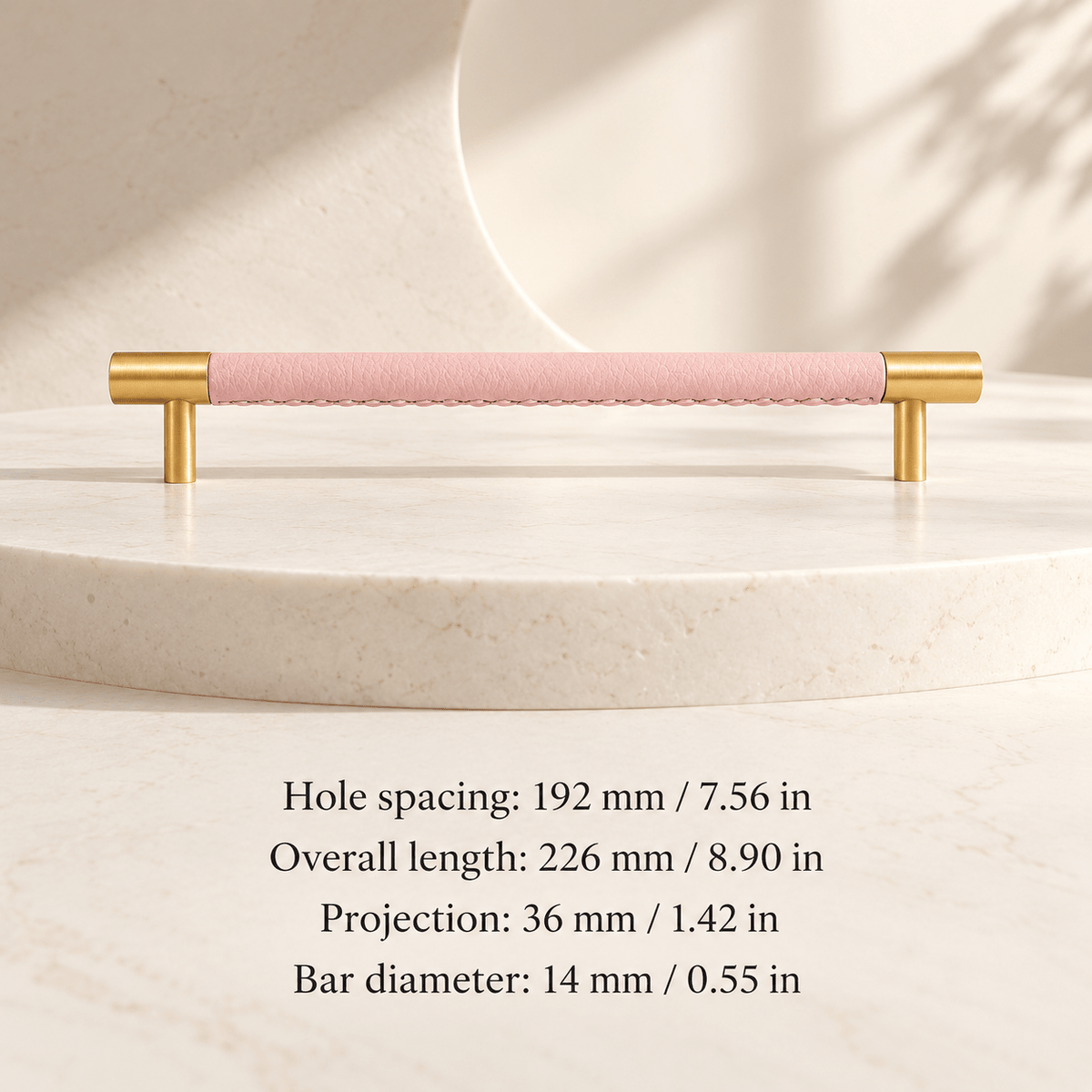 pink leather cabinet pull with gold ends in ivory studio. Hole spacing: 192 mm / 7.56 in; Overall length: 226 mm / 8.90 in; Projection: 36 mm / 1.42 in; Bar diameter: 14 mm / 0.55 in