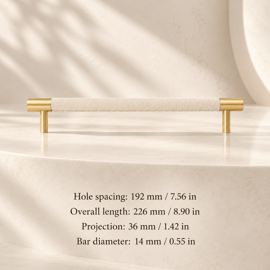 ivory white leather cabinet pull with gold ends in ivory studio. Hole spacing: 192 mm / 7.56 in; Overall length: 226 mm / 8.90 in; Projection: 36 mm / 1.42 in; Bar diameter: 14 mm / 0.55 in