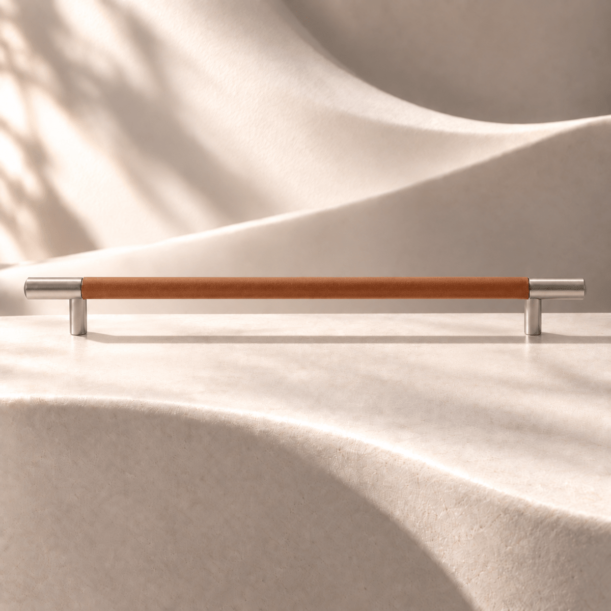 Brown cowhide-wrapped cabinet pull, 320 mm CTC, ivory stone studio