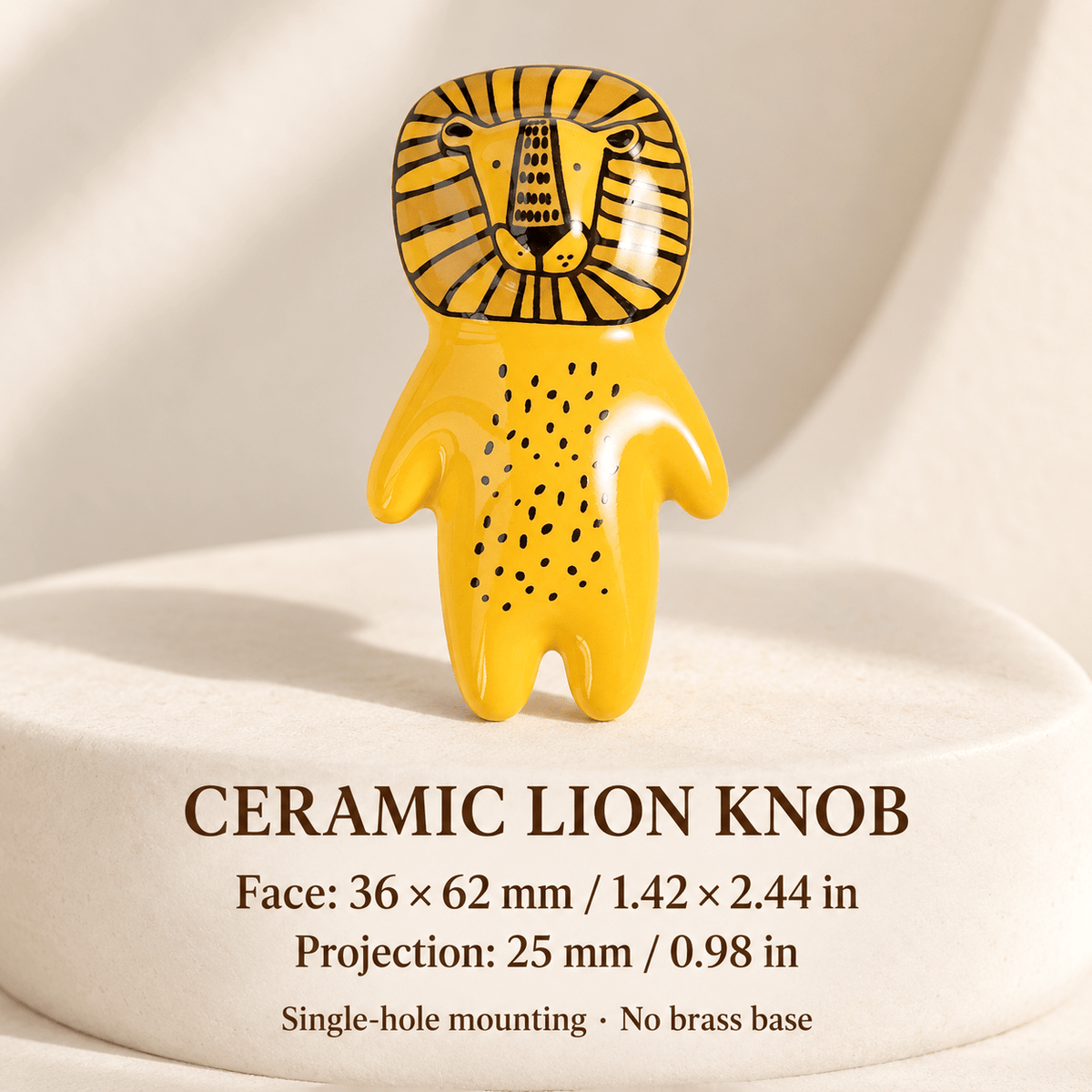 Yellow ceramic lion cabinet knob, no brass base, on ivory stone: face 36 × 62 mm / 1.42 × 2.44 in; projection 25 mm / 0.98 in.