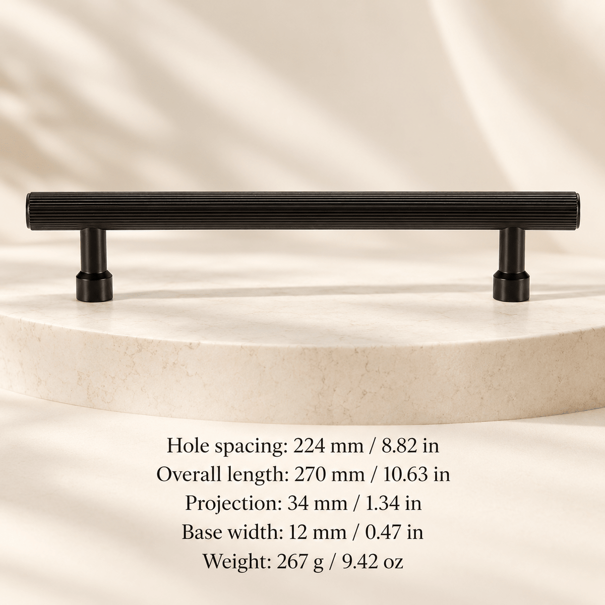 Black pull — 224 mm / 8.82 in CTC; Hole spacing: 224 mm / 8.82 in; Overall length: 270 mm / 10.63 in; Projection: 34 mm / 1.34 in; Base width: 12 mm / 0.47 in; Weight: 267 g / 9.42 oz on ivory stone studio background
